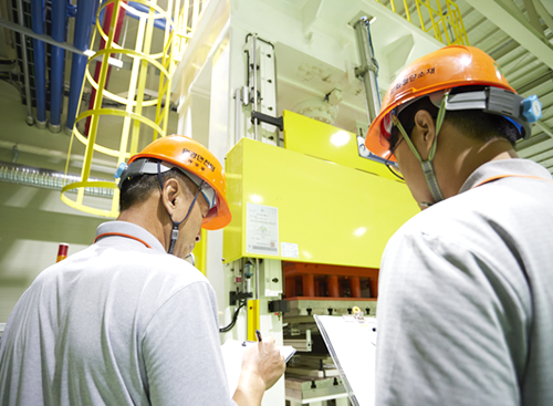 Photo of employees inspecting safety